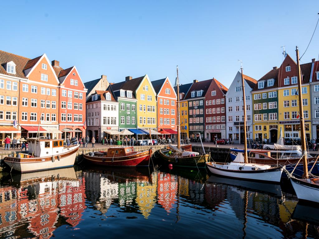 Colourful harbour houses and wooden boats in Copenhagen